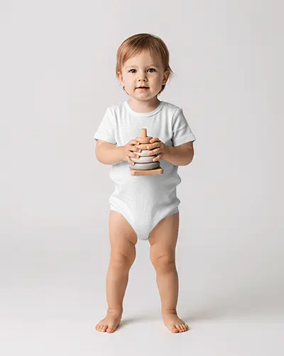 Studio Baby Onesie Mockup Standing Toddler Holding Toy Front View Clean White Background