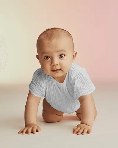 Baby Onesie Mockup Crawling Baby Front View On Soft Gradient Background With Natural Studio Light