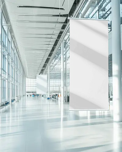 Vertical Banner Mockup Hanging In Modern Airport Terminal With Glass Walls And Bright Light