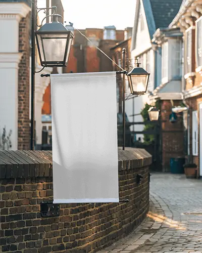 Outdoor Street Banner Mockup Hanging From Black Metal Lamp Post In Charming Brick Alleyway