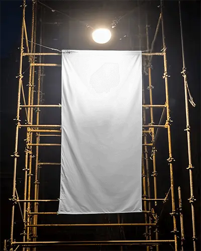 Illuminated Construction Site Vertical Banner Mockup Under Spotlight On Scaffolding Frame At Night