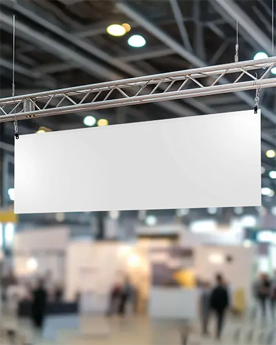 Trade Show Banner Display Mockup Suspended Above Booth With Blurred Event Background
