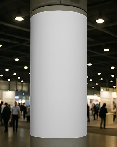 Vertical Column Banner Mockup Mounted On Round Pillar In Modern Exhibition Hall With Soft Blurred Crowd
