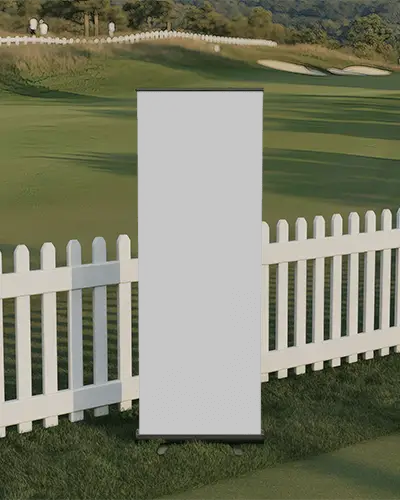 Sports Event Banner Mockup Clean White Standee On Grass Field Near Golf Course Fence In Natural Light