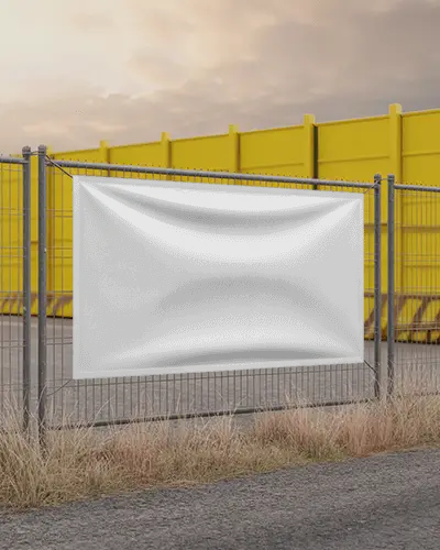 industrial-fence-banner-mockup-in-front-of-yellow-panels-at-sunset-with-dry-grass-edge