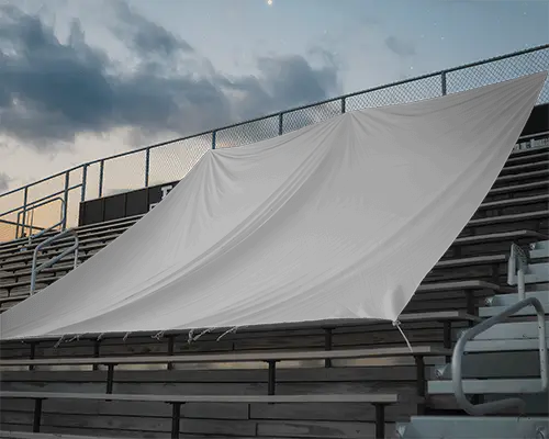 blank-sports-stadium-banner-mockup-hanging-on-metal-railings-and-wooden-bleachers-background