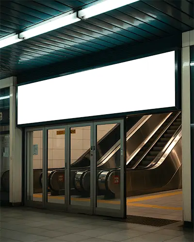 large-illuminated-banner-mockup-at-subway-station-entrance-with-automatic-doors
