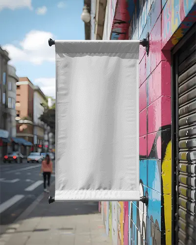 street-banner-mockup-for-retail-promotion-hanging-near-urban-wall-art-and-sidewalk