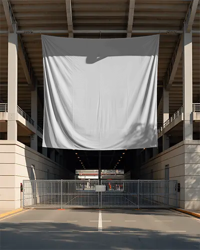 large-urban-banner-mockup-hanging-from-structure-over-metal-gated-entrance-display
