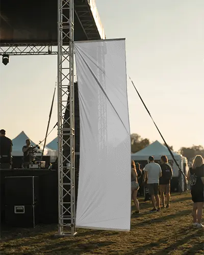 Blank Tension Fabric Banner Mockup At Open Air Event With Visible Support Structure