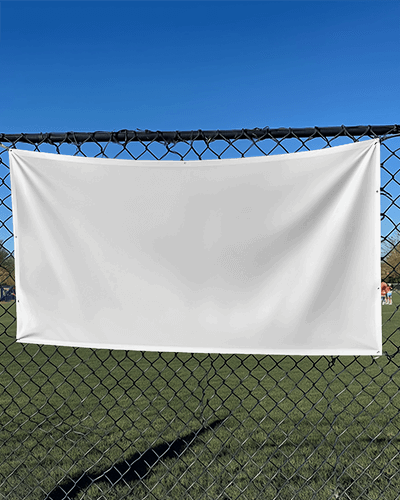 Outdoor Banner Mockup Hanging On Chain Link Fence Under Clear Blue Sky Sports Field Background Sunny Day Display