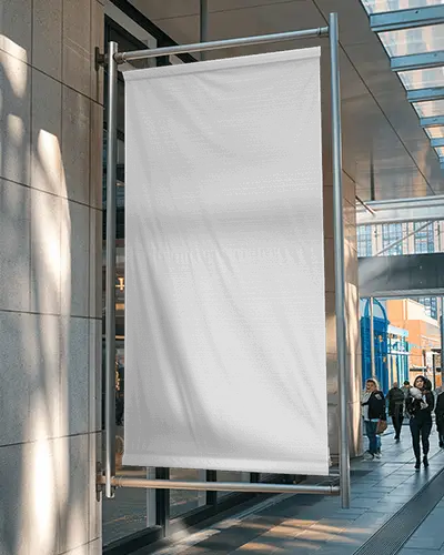 City Street Banner Mockup Vertical Hanging Sign Outside Modern Building With Glass Reflections And Pedestrians In Daylight