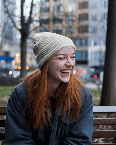 Cozy Autumn Beanie Mockup Red Knit Hat With Vintage Tiger Design Side Profile Female Model In Soft Light