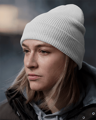 urban-streetwear-beanie-mockup-dark-olive-knit-hat-with-bold-graphic-and-kitsune-logo-on-focused-woman