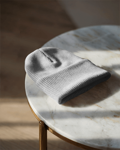 trendy-casual-beanie-mockup-deep-blue-knit-hat-with-graphic-text-and-subtle-floral-details