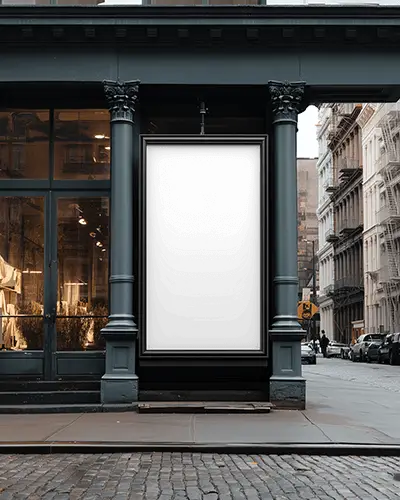 street-vertical-billboard-mockup-display-between-pillars-in-front-of-luxury-retail-building