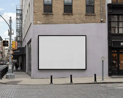 urban-street-corner-horizontal-billboard-mockup-old-brick-building-and-cobblestone-pavement