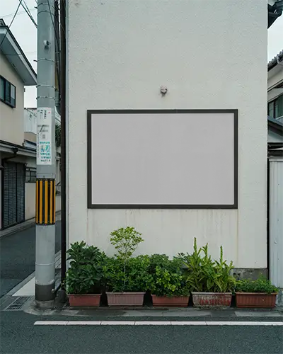 urban-street-billboard-mockup-on-wall-with-plants-for-advertising-and-promotion-0536