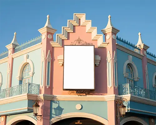 classic-architectural-facade-with-ornate-billboard-mockup-isolated-on-clear-sky-background