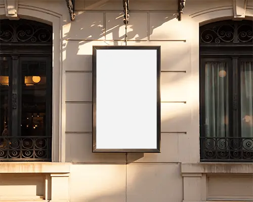vertical-street-billboard-mockup-on-architectural-facade-with-decorative-window-frames