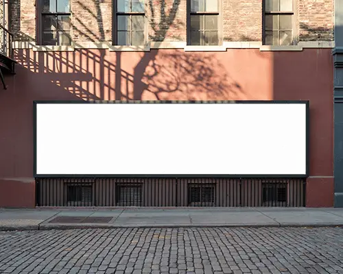 Urban Street Billboard Mockup On Red Brick Wall Above Cobblestone Road