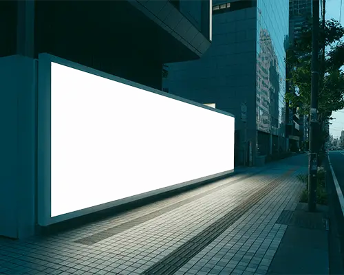 Modern Billboard Mockup Glowing At Night On Urban City Street With Reflective Glass Buildings