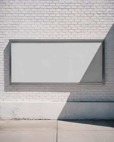 Clean Billboard Mockup Mounted On White Brick Wall With Angled Shadows In Minimal Street View