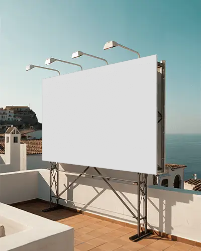 Rooftop Billboard Mockup With Lights Overlooking Seaside Village Summer Sunset