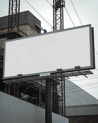 Large Empty Billboard Mockup On Industrial Building Backdrop For Advertising