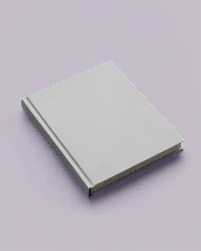 Book Mockup Angled Top View Grey Hardcover On Pastel Purple Surface Soft Lighting Clean Minimal Editorial Style