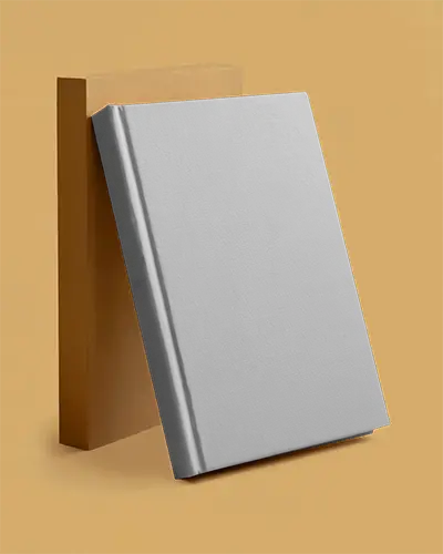 Angled Hardcover Book Mockup Standing Against Rectangular Box On Warm Beige Clean Background