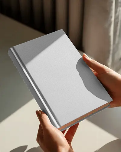 Natural Sunlight Book Mockup Hands Holding Hardcover In Soft Morning Light On Minimal Surface