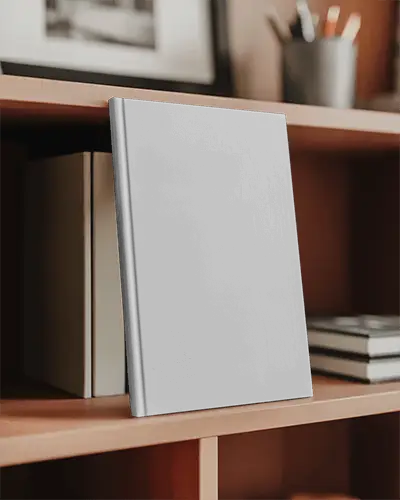 Standing Book Mockup On Shelf Hardcover Leaning Against Books In Home Office Scene With Neutral