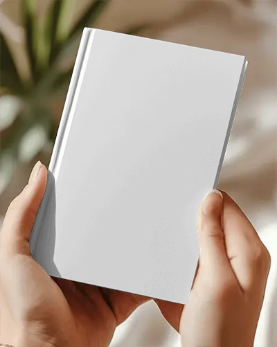 Cozy Book Mockup Female Holding Hardcover In Warm Soft Focus Setting With Bokeh Background