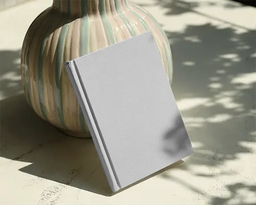 Book Cover Mockup Outdoor Light Hardcover Leaning On Vase With Nature Shadows Over Textured Surface
