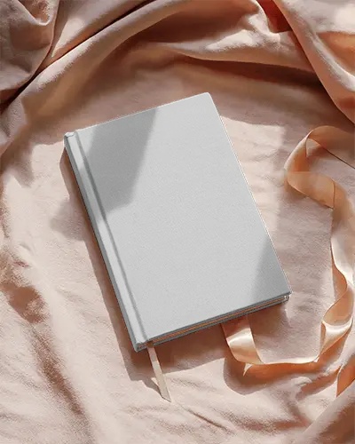 Elegant Book Cover Mockup Soft Bedding Background With Book And Ribbon In Natural Sunlight Cozy Look