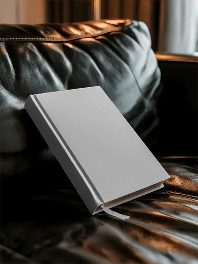 Dramatic Lighting Book Cover Mockup Resting On Leather Sofa For Luxury Mood With Evening Shadow