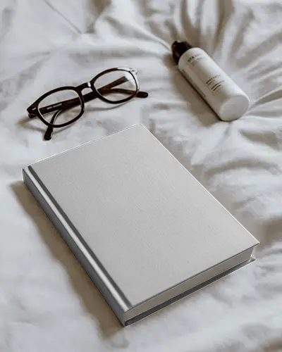 Clean Minimalist Book Mockup With Sunglasses And Cosmetic Bottle On White Fabric