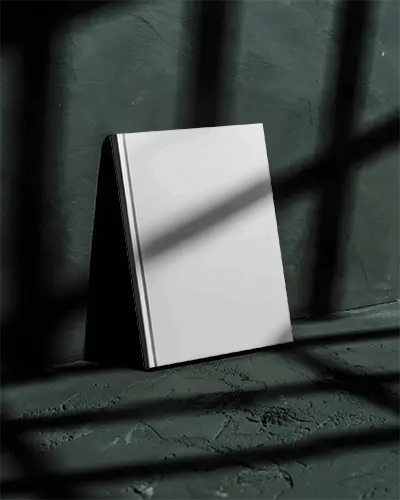 hardcover-book-mockup-with-shadow-play-on-textured-background-for-design-presentation