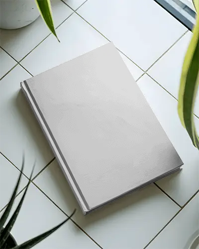 Hardcover Book Mockup On Tiled Surface With Natural Plant Elements For Design Preview