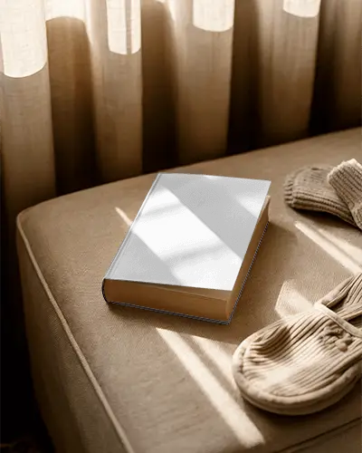 hardcover-book-mockup-with-sunlight-shadow-on-fabric-sofa-for-reading-concept
