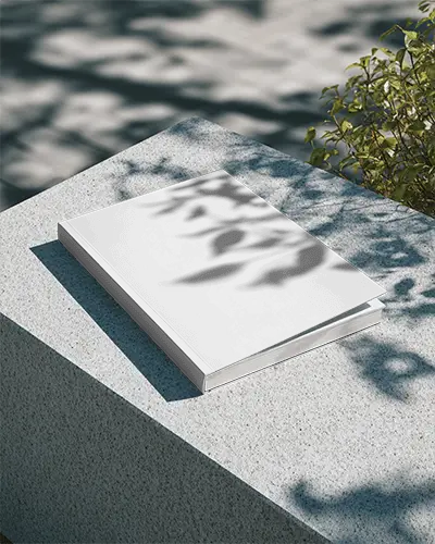 Hardcover Book Mockup On Stone Surface With Soft Shadow Plant Reflection For Design