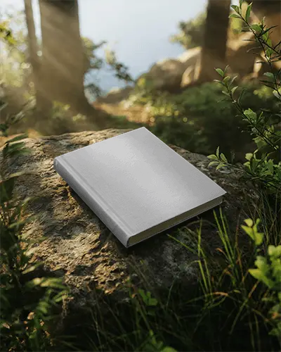 Outdoor Book Mockup Showing Hardcover Lying On Rock In Forest Environment