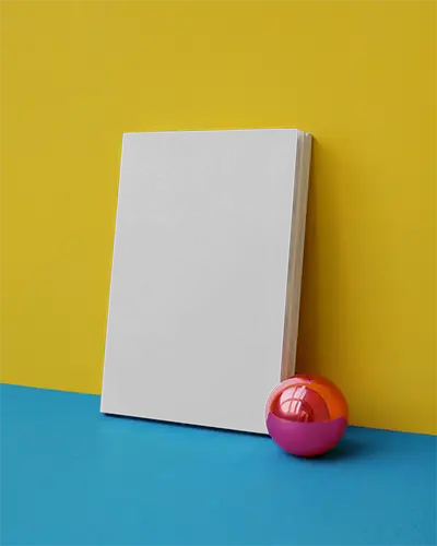 Minimalist Book Mockup With Reflective Sphere Against Bold Contrasting Background For Design