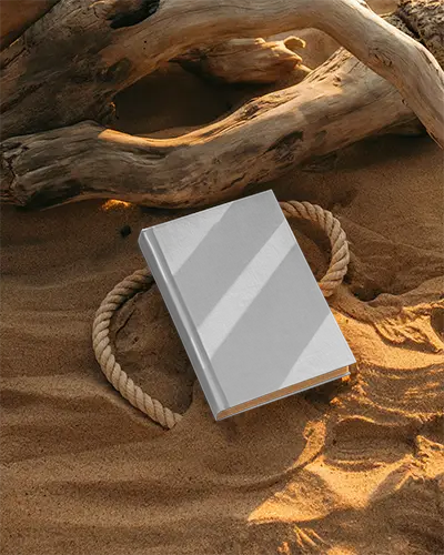 Hardcover Book Mockup Placed On Sand With Natural Driftwood Background Light Shadow
