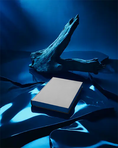 Hardcover Book Mockup On Reflective Surface With Natural Wood Element Photorealistic Design