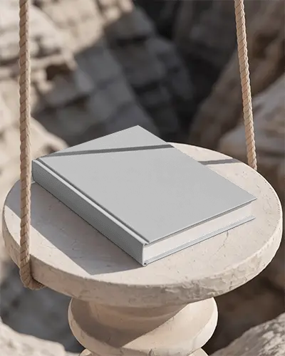Hardcover Book Mockup On Swinging Round Stone Pedestal Outdoor Background