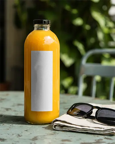 Premium Glass Juice Bottle Mockup On Rustic Table With Folded Napkin And Sunglasses 0217