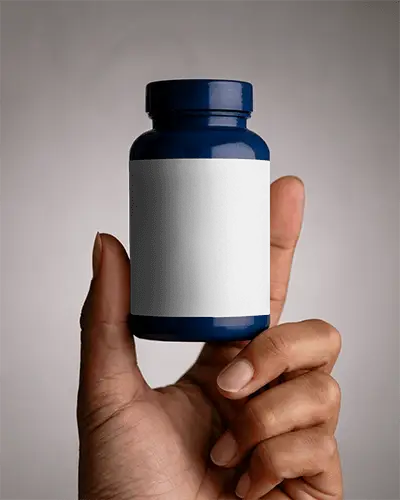 hand-holding-premium-quality-supplement-bottle-mockup-for-branding-and-label-design