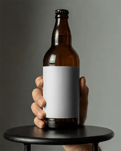 realistic-glass-bottle-mockup-with-empty-label-for-beverage-packaging-presentations